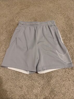 Nike Men's Light Gray Athletic Shorts with White Swoosh Accent